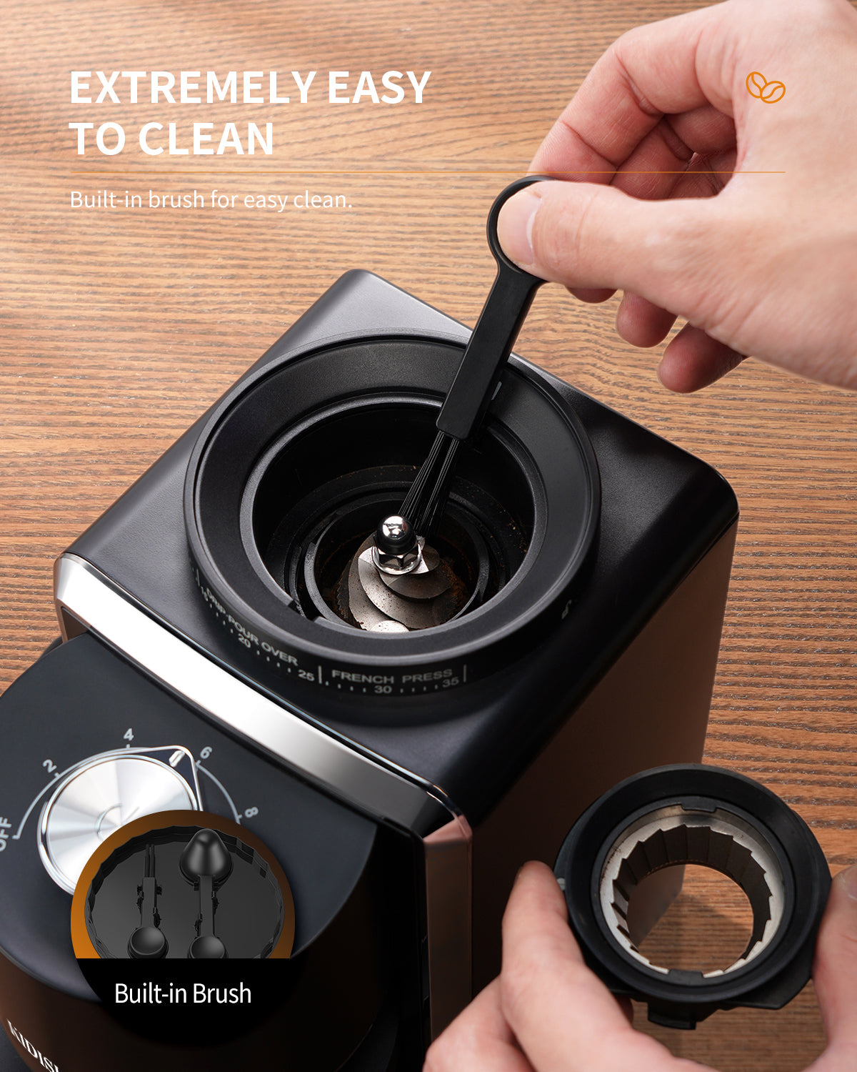 coffee burr grinder being cleaned with its built-in brush, showing 35 precision grind settings.